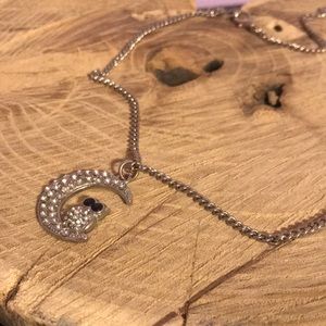 A owl and moon silver necklace